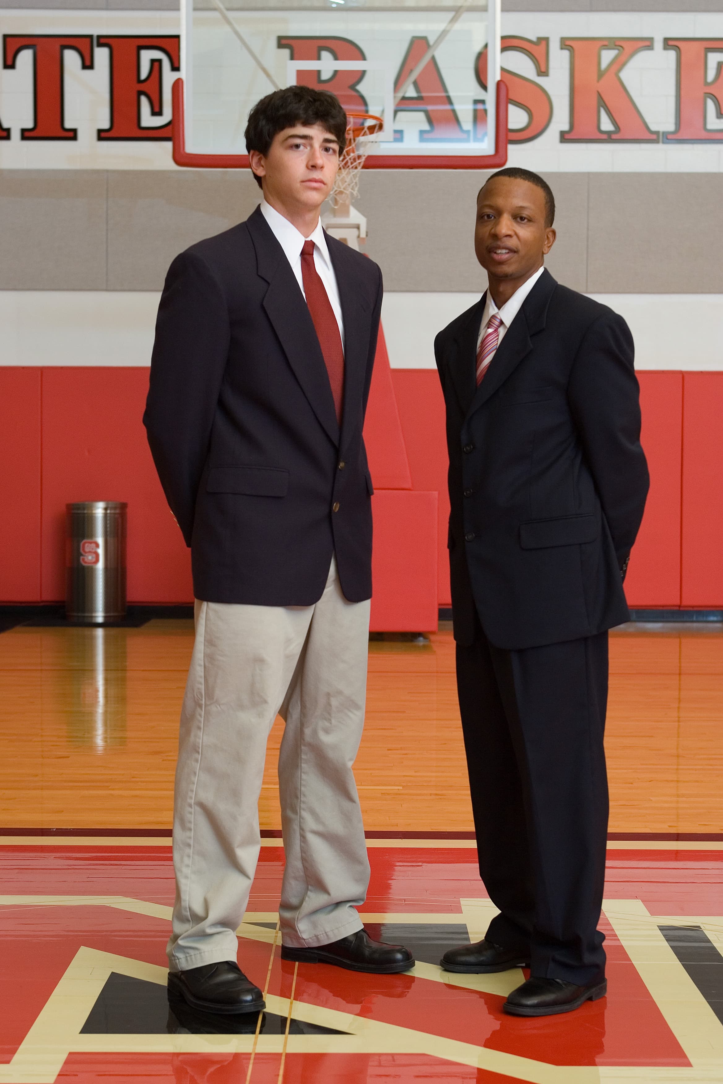 Coach Kenya Davis with an athlete in a gym